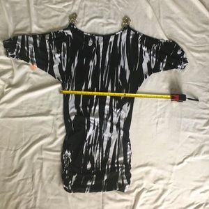NWT black/white cold shoulder dress with metal like shoulder accents.